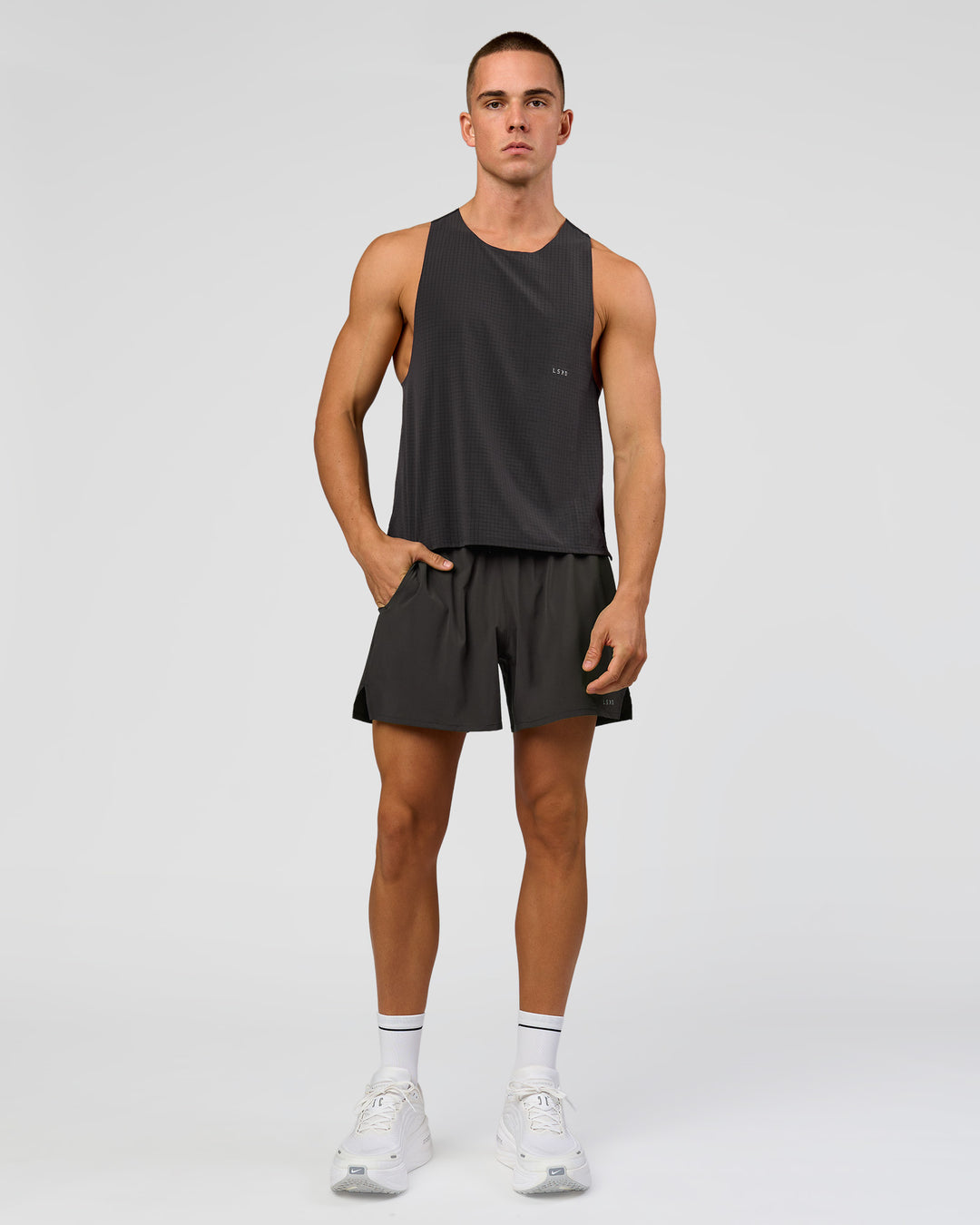 Man wearing Run Club Elevate Pace Running Tank - Onyx-Black | Model:Albert | Size:M - view 3