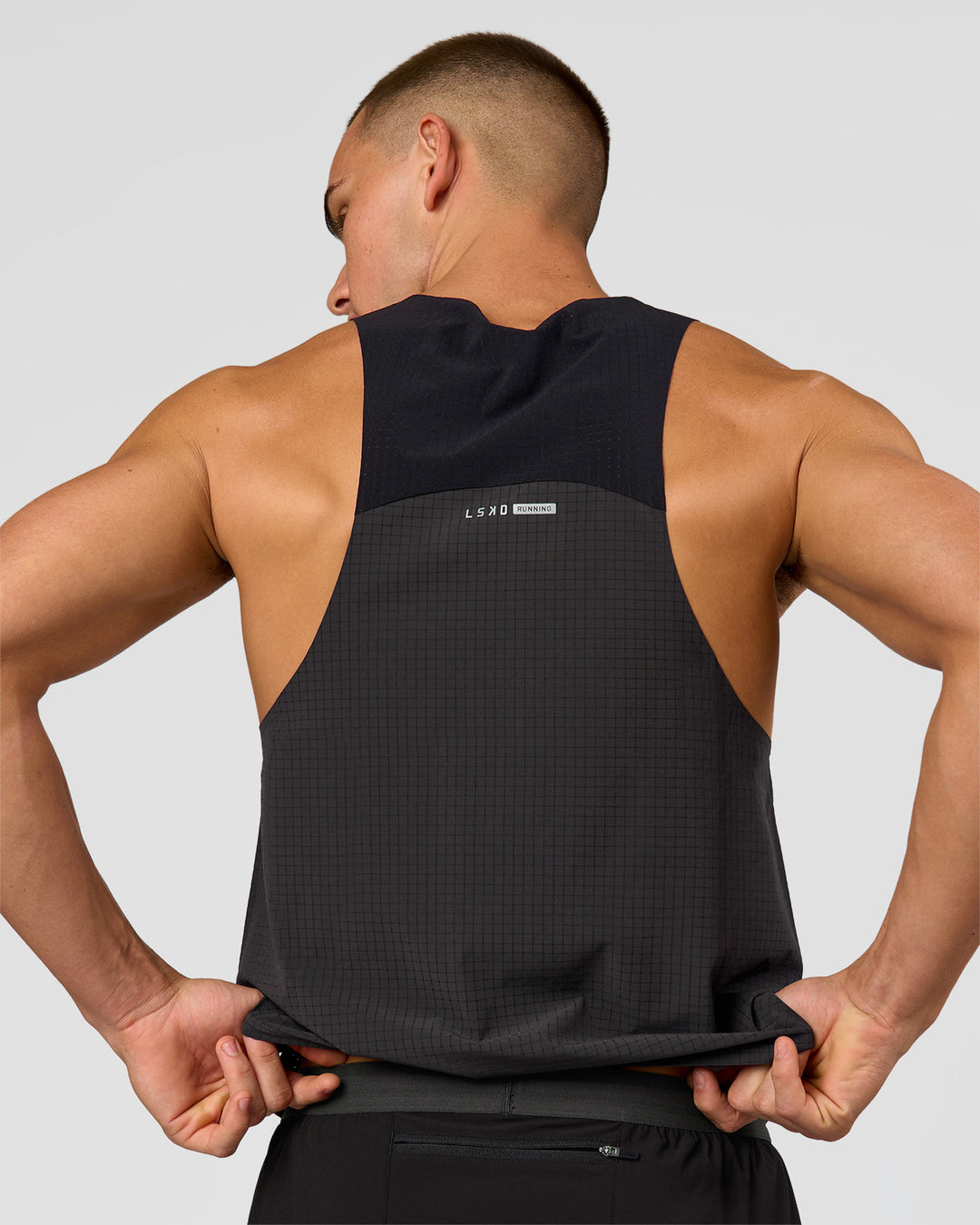 Man wearing Run Club Elevate Pace Running Tank - Onyx-Black | Model:Albert | Size:M - view 2