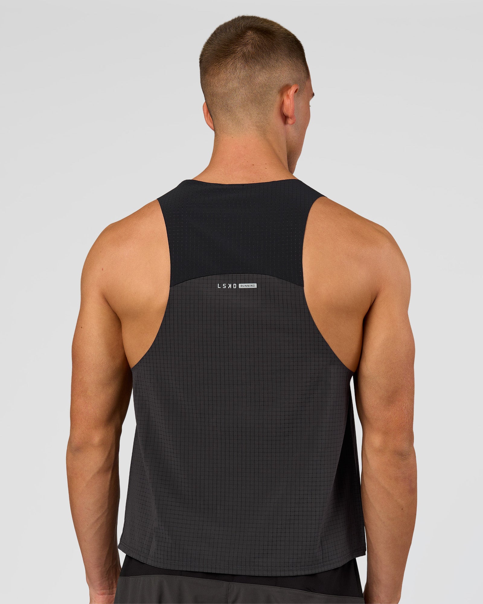 Man wearing Run Club Elevate Pace Running Tank - Onyx-Black | Model:Albert | Size:M