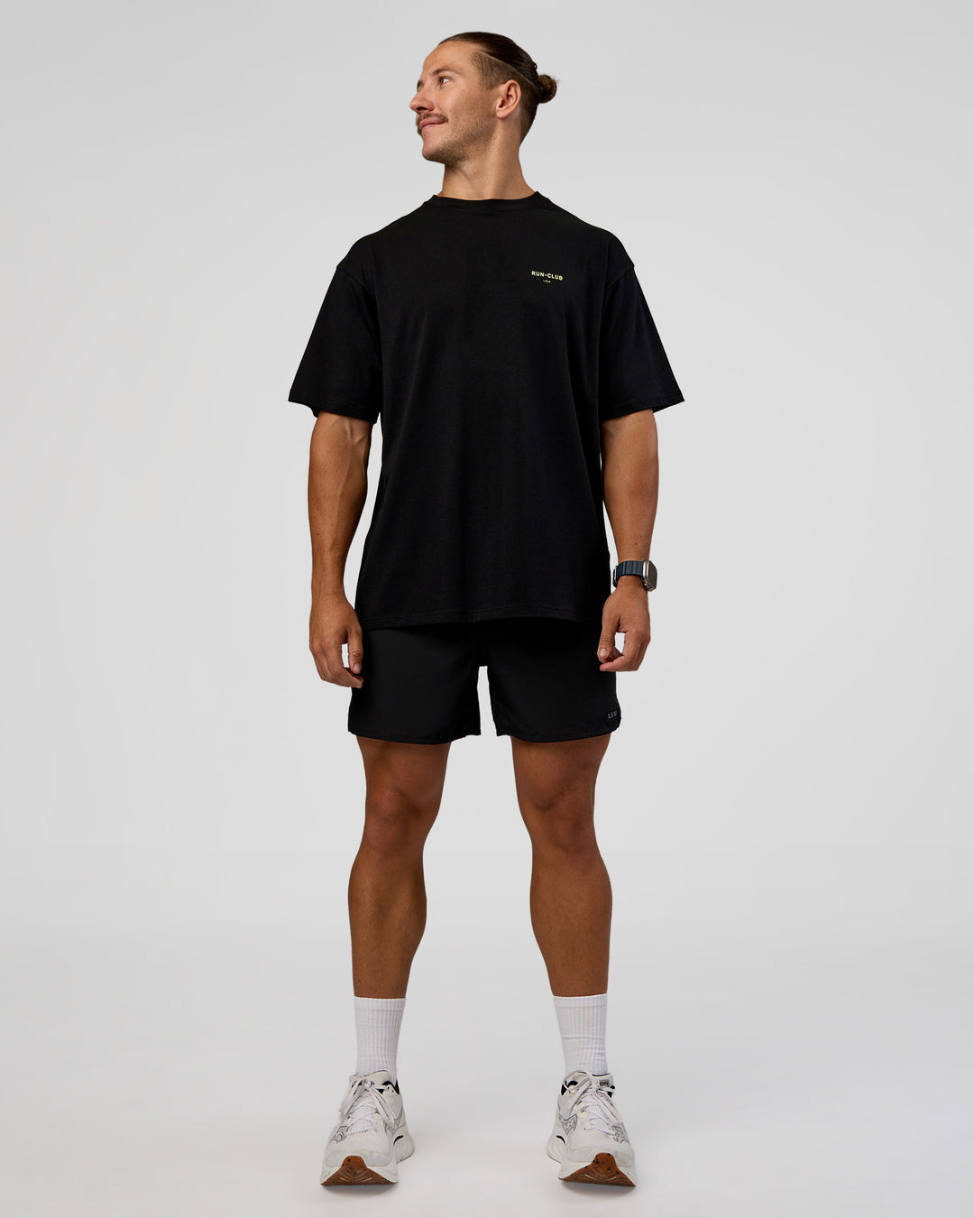 Man wearing RUN CLUB FLXCotton Tee Oversize - Black-Yellow Fizz | Model:Jaiden | Size:M - view 7