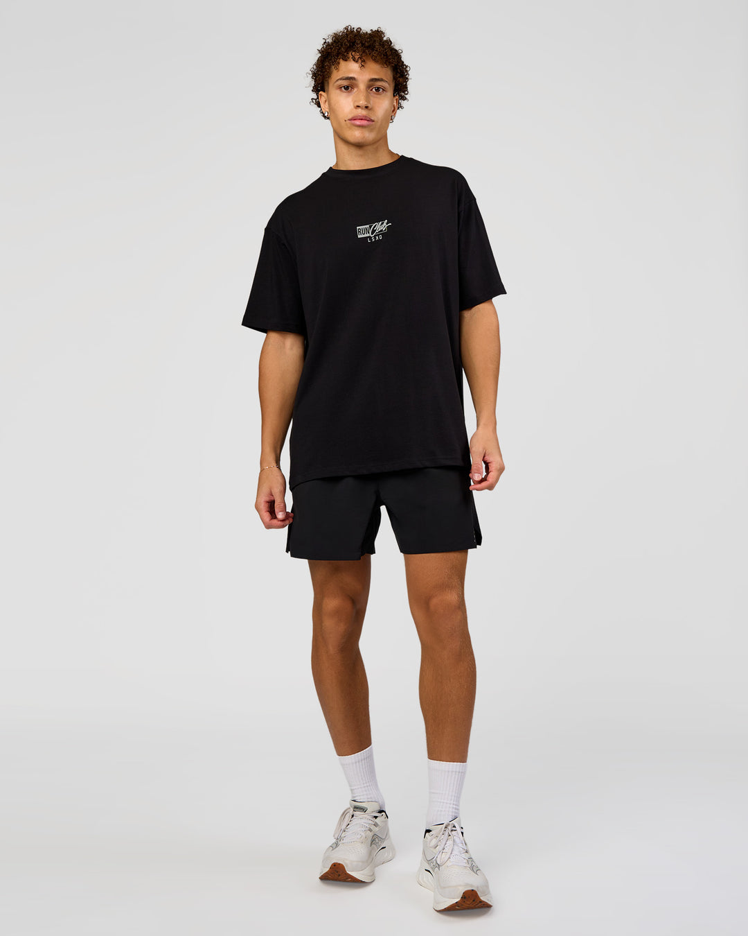 Man wearing Run Club Script FLXCotton Oversized Tee - Black-Alloy | Model:Leandro | Size:M - view 6
