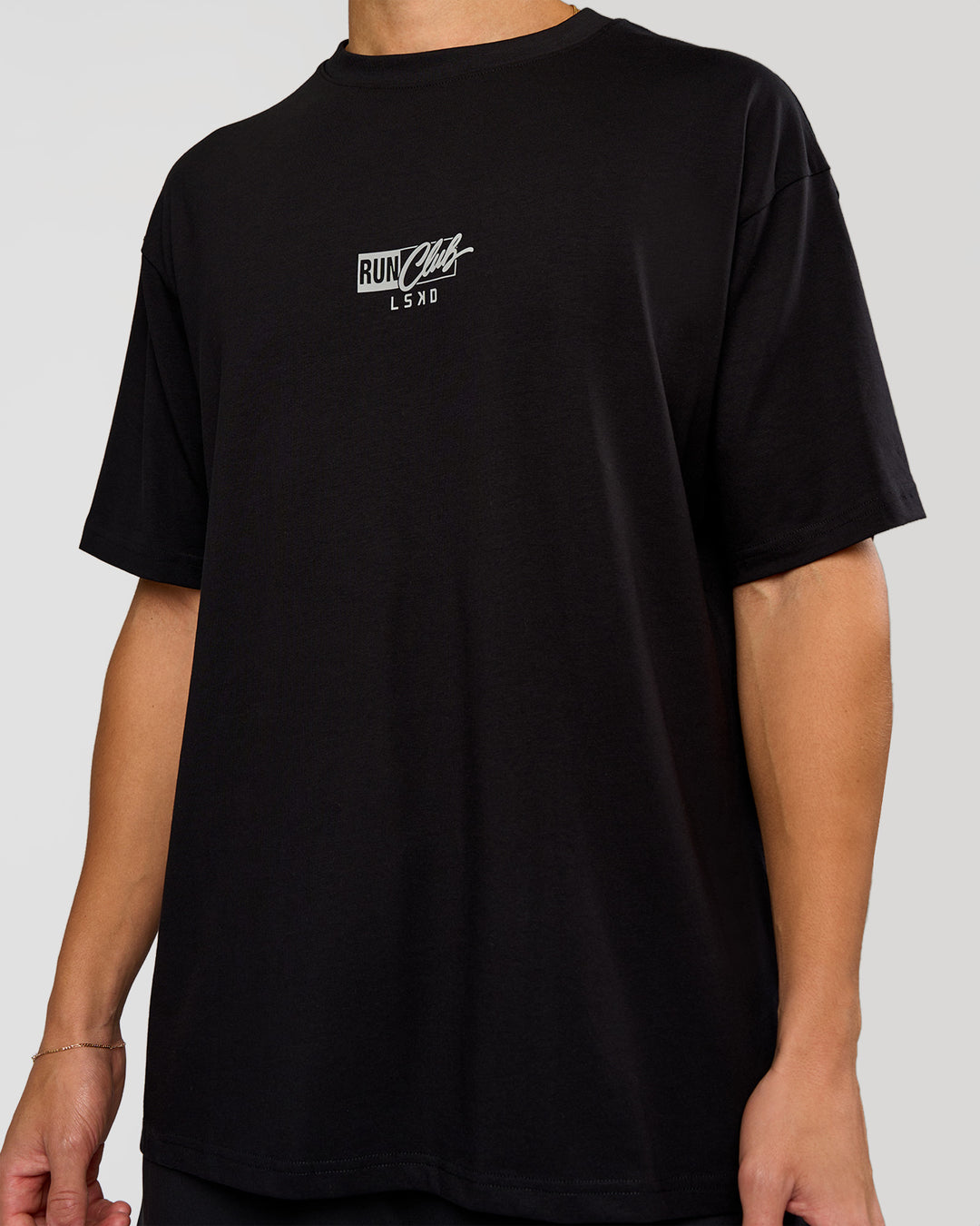 Man wearing Run Club Script FLXCotton Oversized Tee - Black-Alloy | Model:Leandro | Size:M - view 8