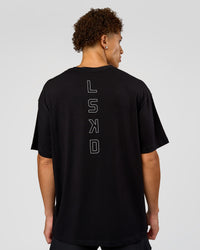 Man wearing Run Club Script FLXCotton Oversized Tee - Black-Alloy | Model:Leandro | Size:M | Thumbnail Index: 2
