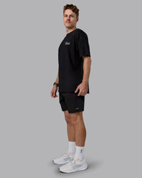 Man wearing Run Love FLXCotton Oversized Tee - Black-Reflective | Model:Cameron | Size:M | Thumbnail Index: 4