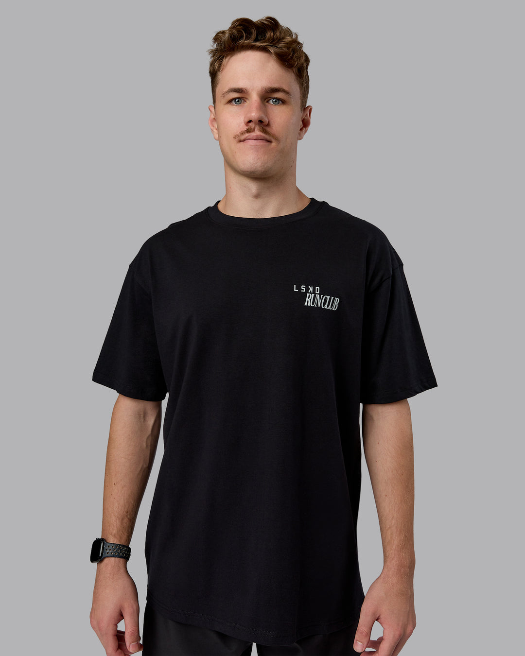 Man wearing Run Love FLXCotton Oversized Tee - Black-Reflective | Model:Cameron | Size:M - view 2
