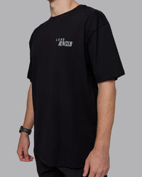 Man wearing Run Love FLXCotton Oversized Tee - Black-Reflective | Model:Cameron | Size:M | Thumbnail Index: 7