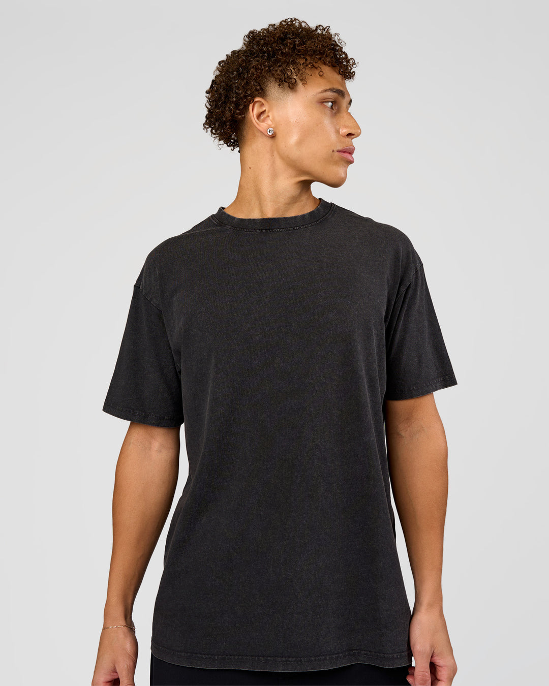 Man wearing Shadow Mode FLXCotton Oversized Tee - Black Washed | Model:Leandro | Size:M - view 3
