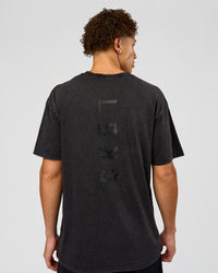 Man wearing Shadow Mode FLXCotton Oversized Tee - Black Washed | Model:Leandro | Size:M | Thumbnail Index: 1