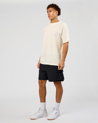 Man wearing Shadow Mode FLXCotton Oversized Tee - Off White Washed | Model:Leandro | Size:M | Thumbnail Index: 11