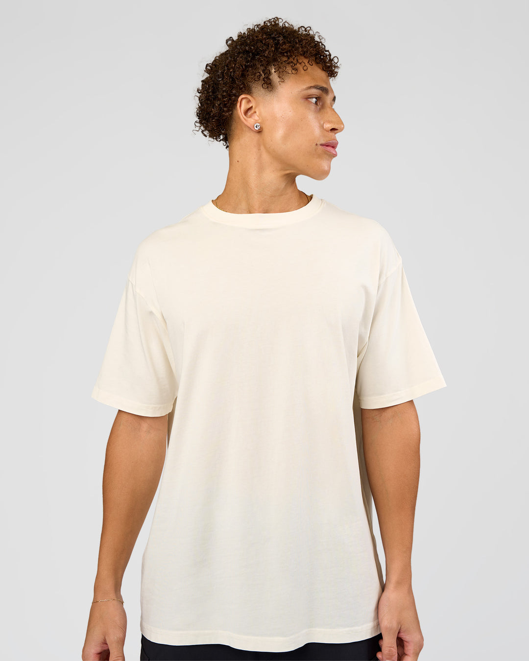 Man wearing Shadow Mode FLXCotton Oversized Tee - Off White Washed | Model:Leandro | Size:M - view 3