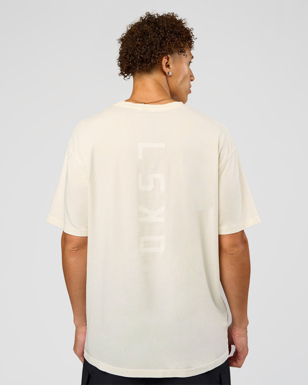 Man wearing Shadow Mode FLXCotton Oversized Tee - Off White Washed | Model:Leandro | Size:M - view 4