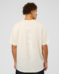 Man wearing Shadow Mode FLXCotton Oversized Tee - Off White Washed | Model:Leandro | Size:M | Thumbnail Index: 3