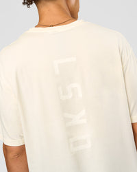 Man wearing Shadow Mode FLXCotton Oversized Tee - Off White Washed | Model:Leandro | Size:M | Thumbnail Index: 10