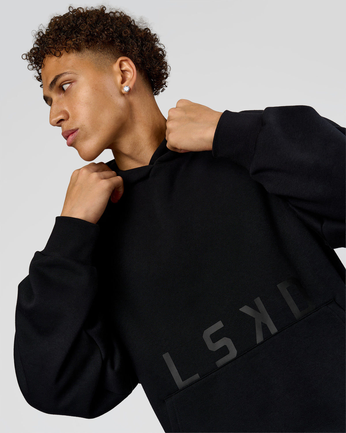 Man wearing Shadow Mode Oversized Hoodie - Black | Model:Leandro | Size:M