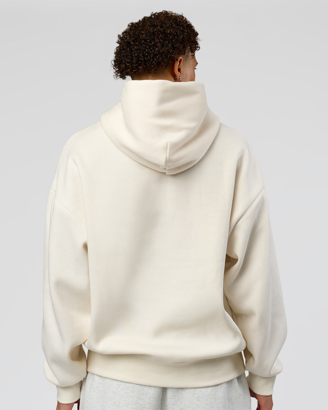 Man wearing Shadow Mode Oversized Hoodie - Off White | Model:Leandro | Size:M - view 3