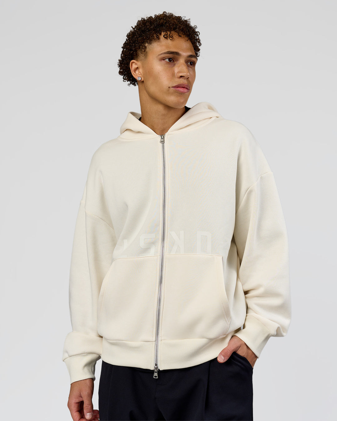 Man wearing Shadow Mode Oversized Zip Through Hoodie - Off White | Model:Leandro | Size:M - view 2