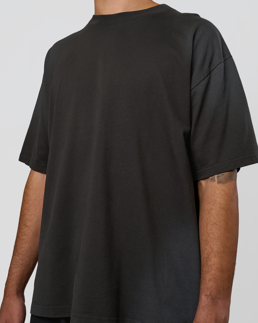 Man wearing Spray Heavyweight Unisex Oversized Tee - Charcoal Washed | Model:Zoran | Size:M - view 9