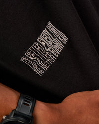 Man wearing Static Grit Heavyweight Oversized Tee - Black-Alloy | Model:Malebo | Size:M | Thumbnail Index: 2