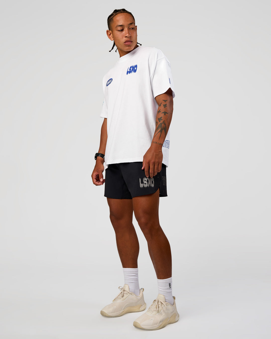Man wearing Static Grit Heavyweight Oversized Tee - White-Electric Indigo | Model:Malebo | Size:M - view 3