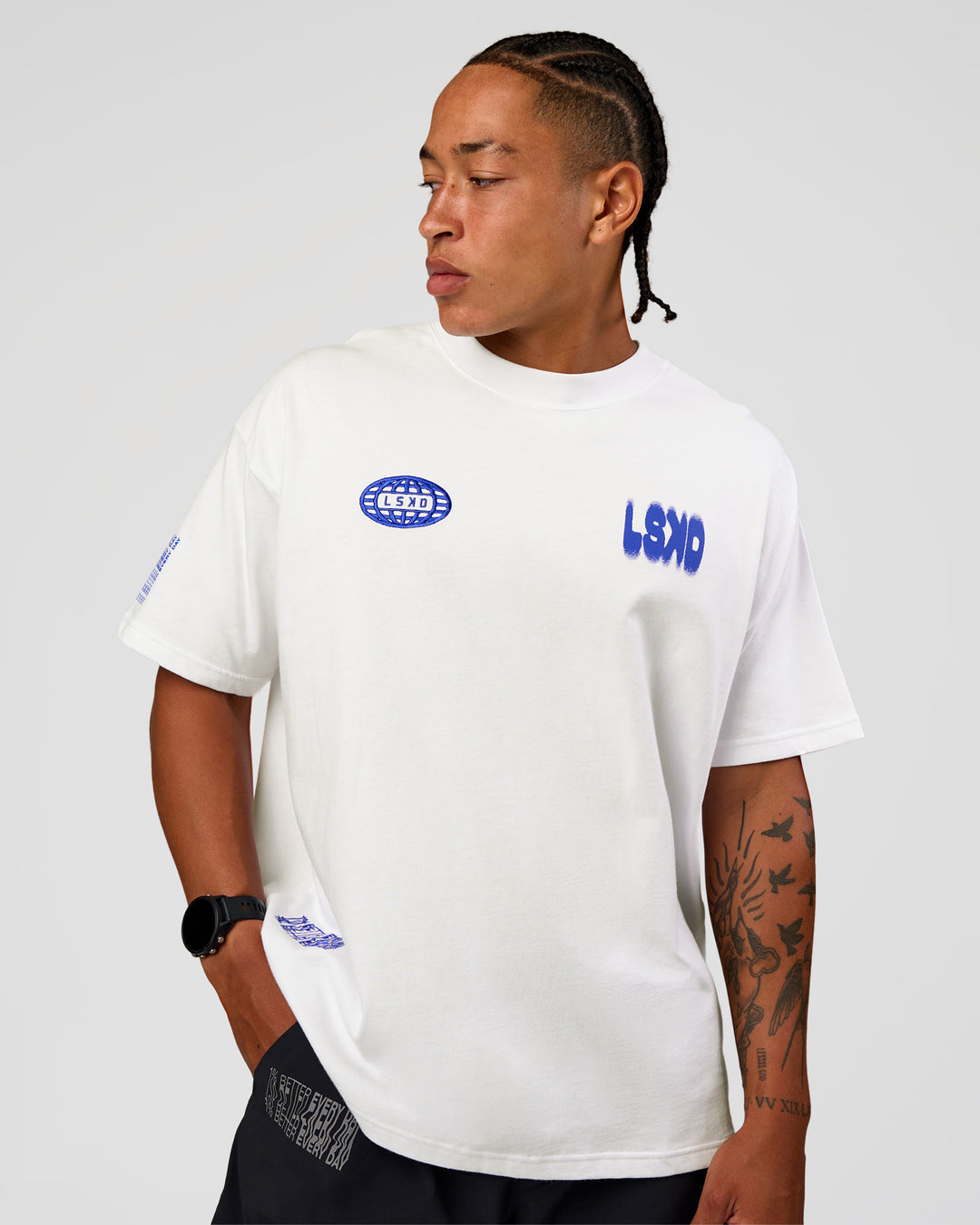Man wearing Static Grit Heavyweight Oversized Tee - White-Electric Indigo | Model:Malebo | Size:M - view 2