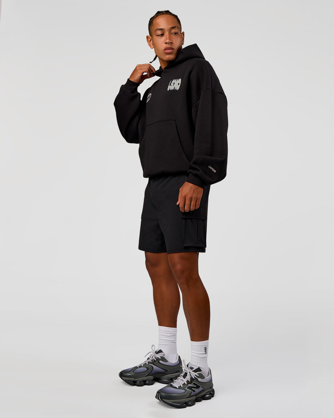 Man wearing Static Grit Unisex Boxy Hoodie - Black-Alloy | Model:Malebo | Size:M - view 13