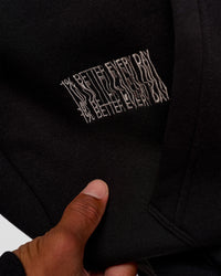 Man wearing Static Grit Unisex Boxy Hoodie - Black-Alloy | Model:Malebo | Size:M | Thumbnail Index: 10