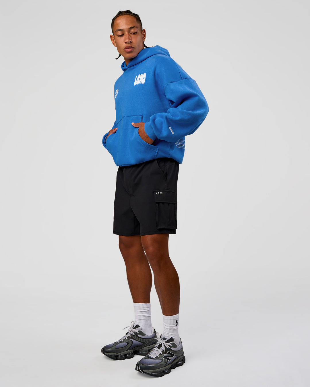 Man wearing Static Grit Unisex Boxy Hoodie - Palace Blue-White | Model:Malebo | Size:M - view 12