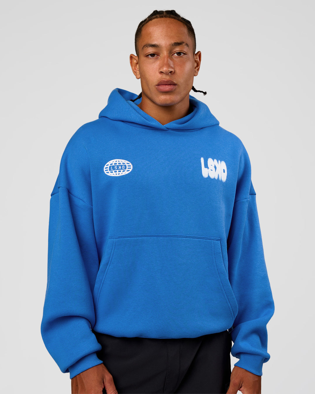 Man wearing Static Grit Unisex Boxy Hoodie - Palace Blue-White | Model:Malebo | Size:M - view 3