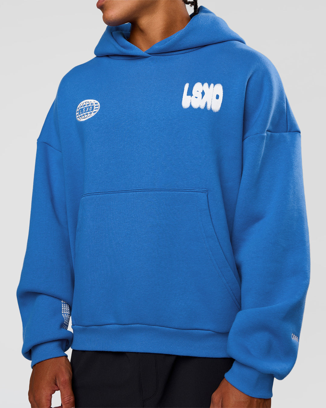 Man wearing Static Grit Unisex Boxy Hoodie - Palace Blue-White | Model:Malebo | Size:M - view 9
