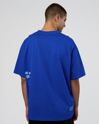 Man wearing Sticker Heavyweight Oversized Tee - Electric Indigo-Baltic Sea | Model:Zoran | Size:M | Thumbnail Index: 5