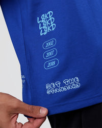 Man wearing Sticker Heavyweight Oversized Tee - Electric Indigo-Baltic Sea | Model:Zoran | Size:M | Thumbnail Index: 2
