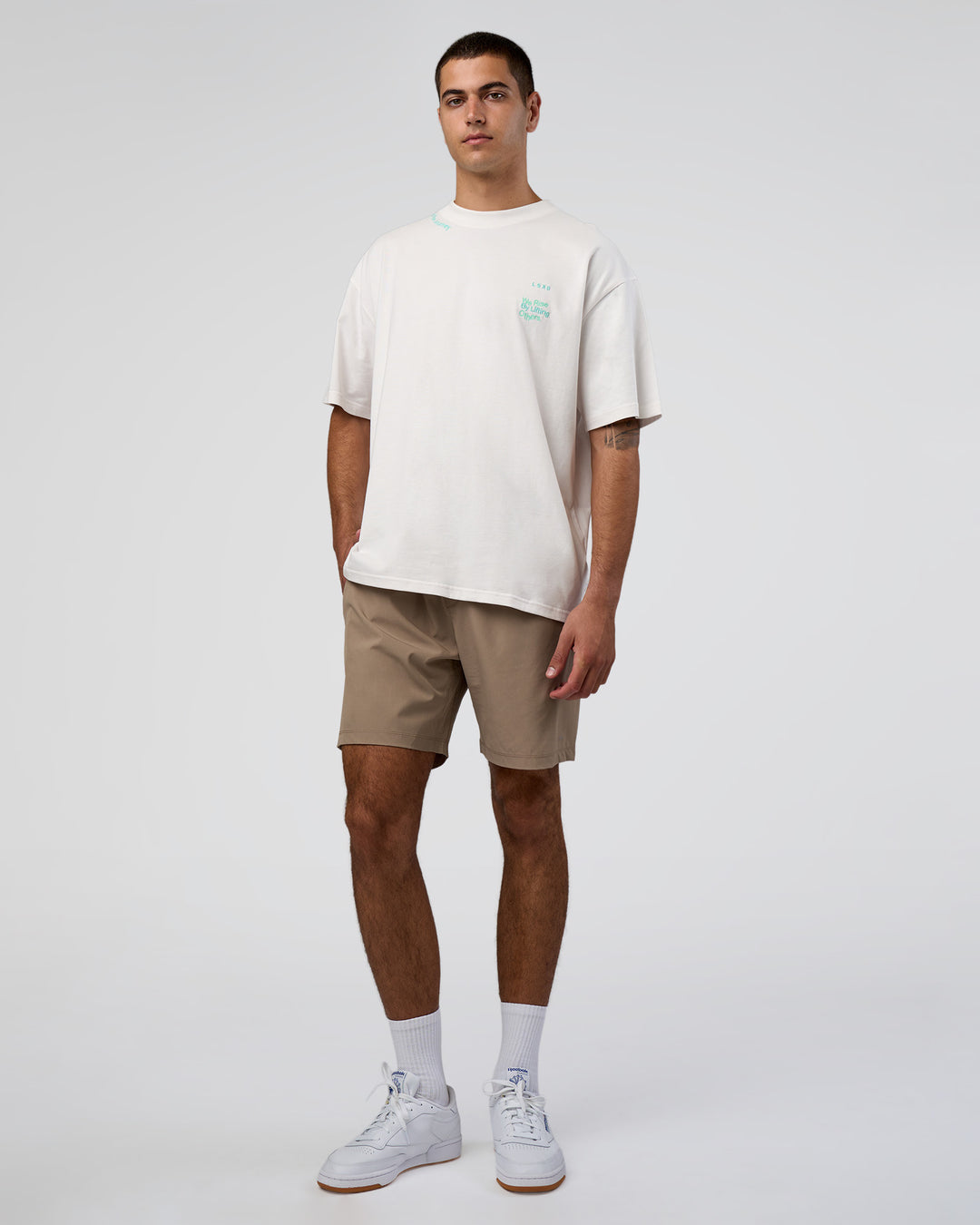 Man wearing Sticker Heavyweight Oversized Tee - Off White-Jelly Mint | Model:Zoran | Size:M - view 7