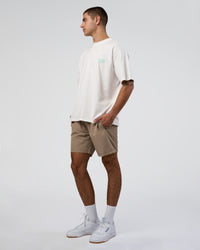 Man wearing Sticker Heavyweight Oversized Tee - Off White-Jelly Mint | Model:Zoran | Size:M | Thumbnail Index: 5