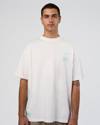 Man wearing Sticker Heavyweight Oversized Tee - Off White-Jelly Mint | Model:Zoran | Size:M | Thumbnail Index: 3