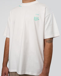 Man wearing Sticker Heavyweight Oversized Tee - Off White-Jelly Mint | Model:Zoran | Size:M | Thumbnail Index: 7
