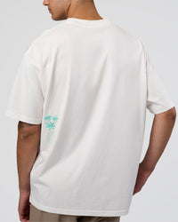 Man wearing Sticker Heavyweight Oversized Tee - Off White-Jelly Mint | Model:Zoran | Size:M | Thumbnail Index: 4
