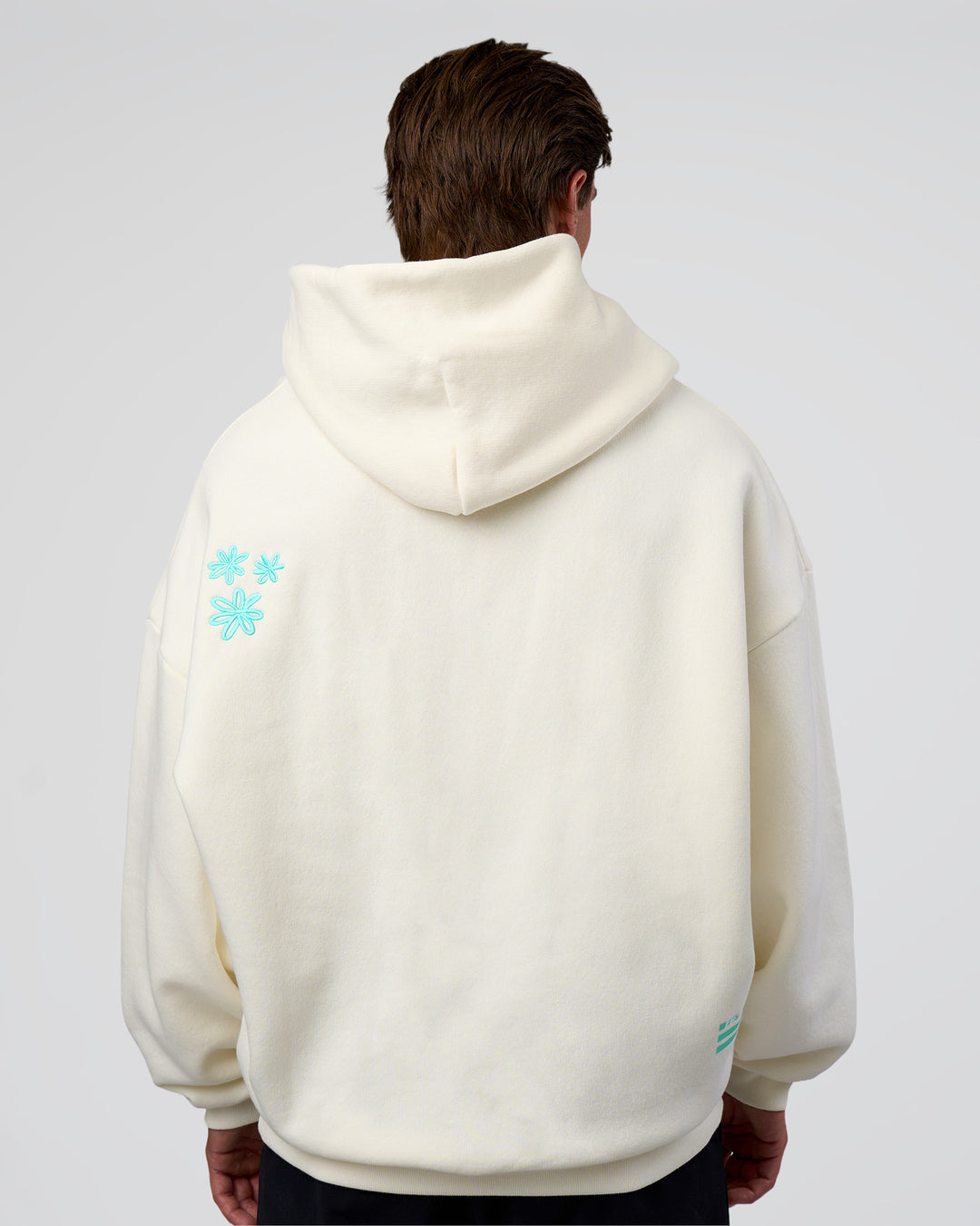Man wearing Sticker Unisex Oversized Hoodie - Off White-Jelly Mint | Model:Konnor | Size:M - view 10