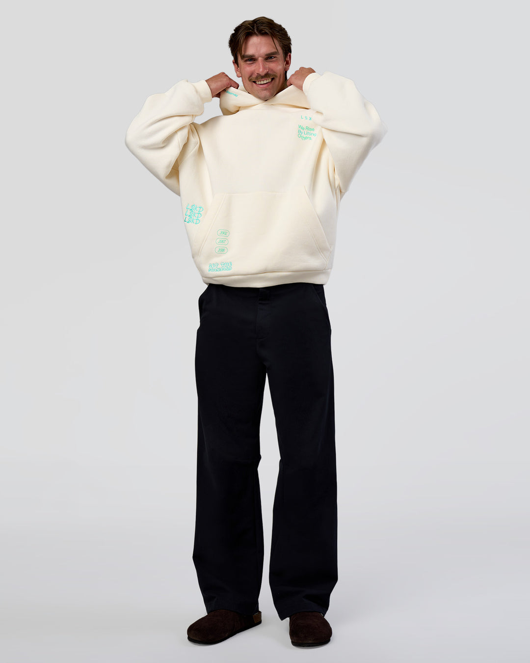 Man wearing Sticker Unisex Oversized Hoodie - Off White-Jelly Mint | Model:Konnor | Size:M - view 3