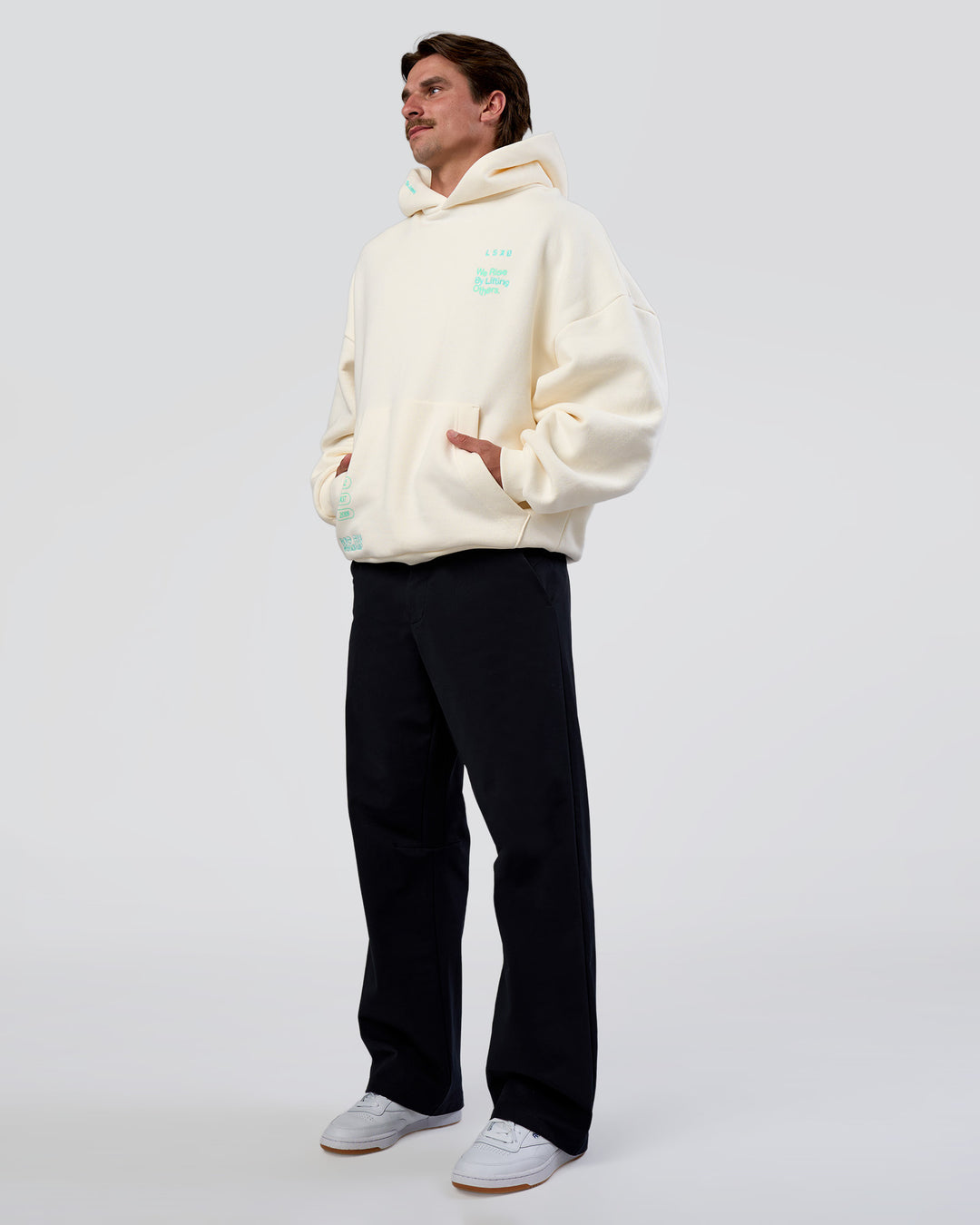 Man wearing Sticker Unisex Oversized Hoodie - Off White-Jelly Mint | Model:Konnor | Size:M - view 11