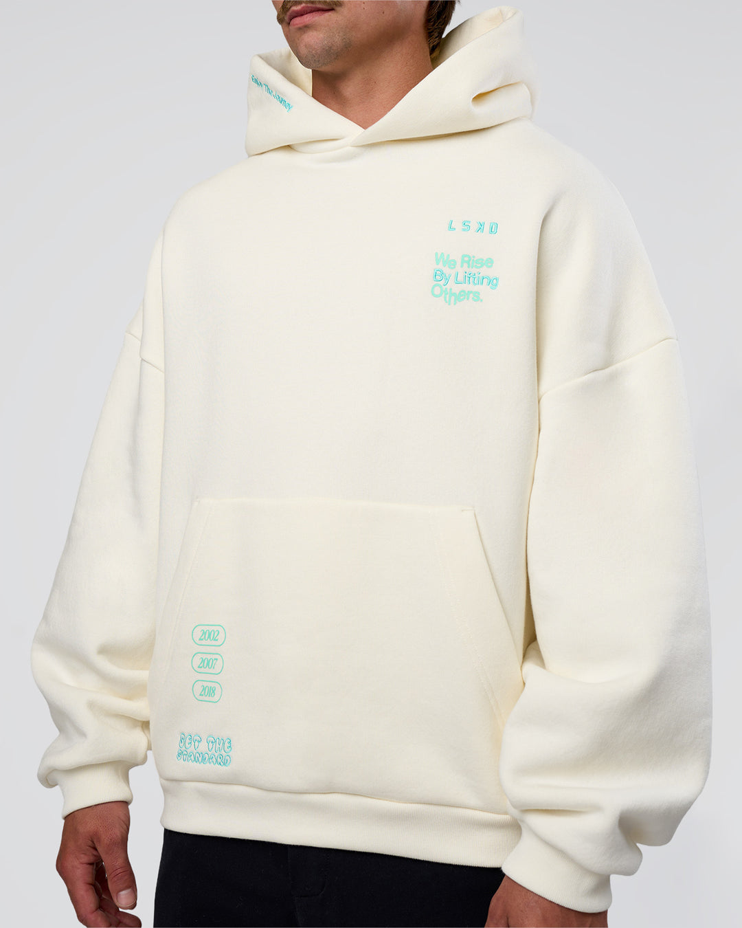 Man wearing Sticker Unisex Oversized Hoodie - Off White-Jelly Mint | Model:Konnor | Size:M - view 15