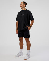 Man wearing Trust The Process Heavyweight Unisex Oversized Tee - Black-White | Model:Jaiden | Size:M | Thumbnail Index: 5