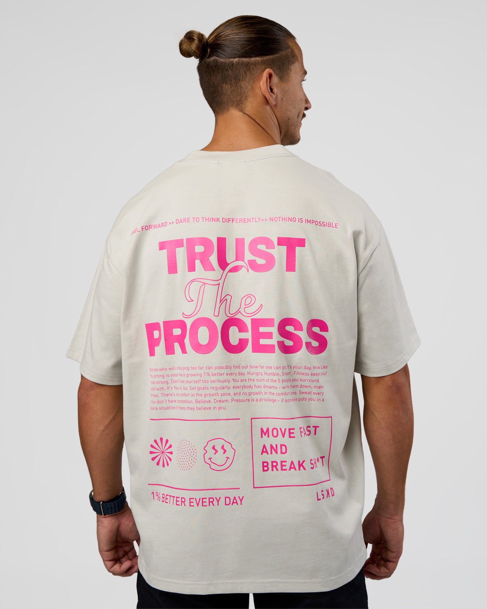 Man wearing Trust The Process Heavyweight Unisex Oversized Tee - Digital Mist-Ultra Pink | Model:Jaiden | Size:M