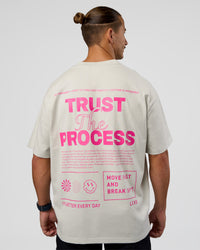 Man wearing Trust The Process Heavyweight Unisex Oversized Tee - Digital Mist-Ultra Pink | Model:Jaiden | Size:M | Thumbnail Index: 1