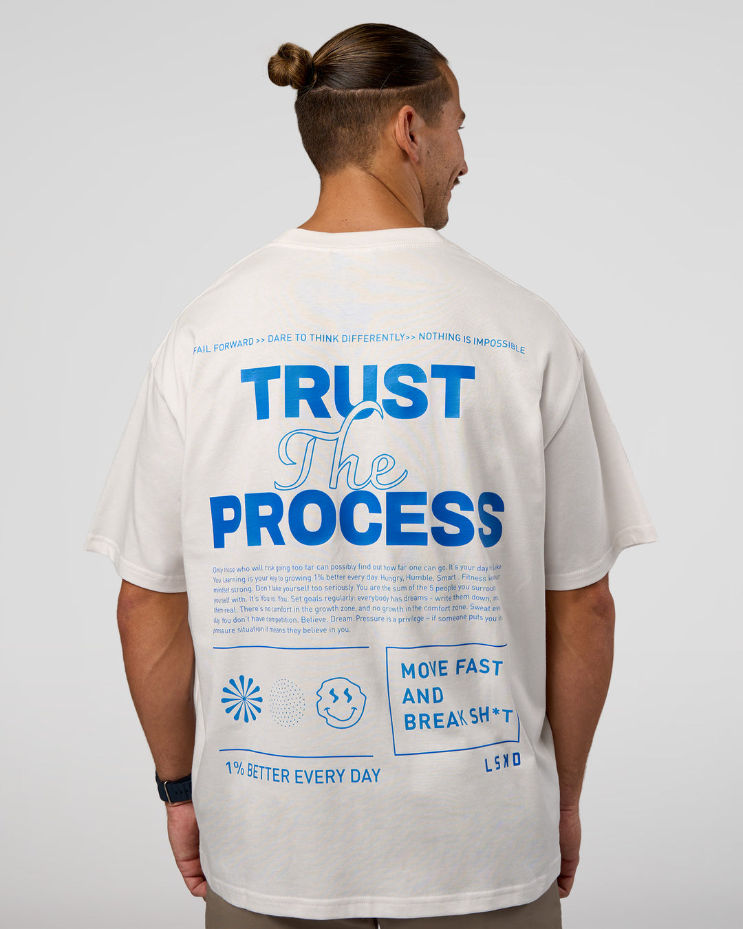 Man wearing Trust The Process Heavyweight Unisex Oversized Tee - Off White-Electric Indigo | Model:Jaiden | Size:M - view 3