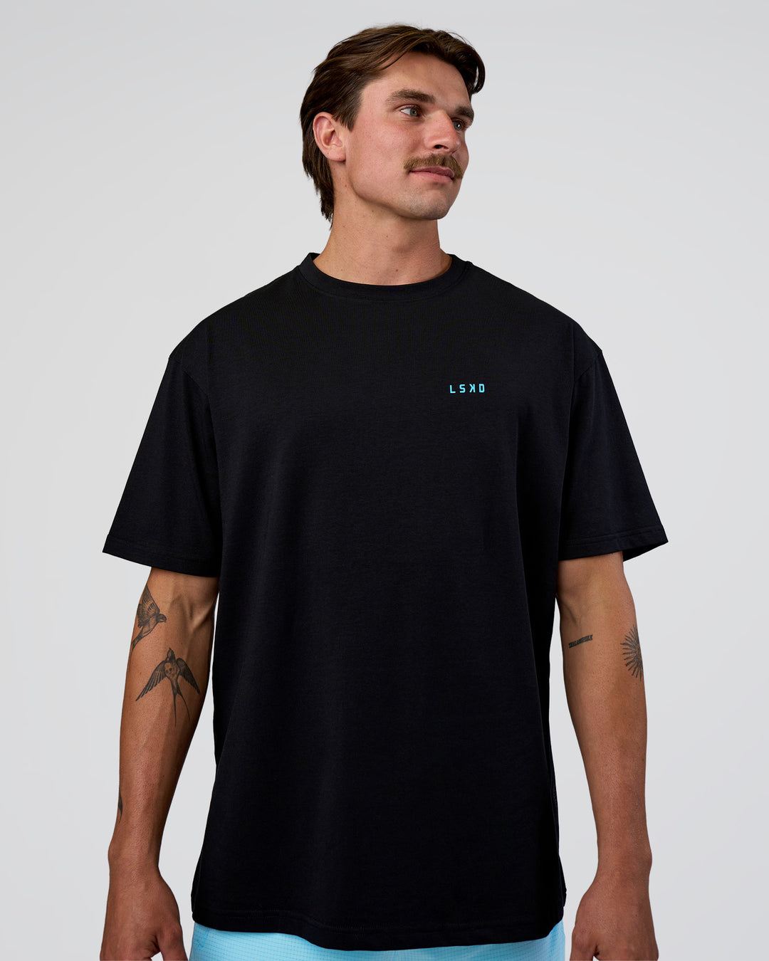 Man wearing Unfit Club FLXCotton Oversized Tee - Black-White | Model:Konnor | Size:M - view 3