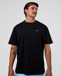 Man wearing Unfit Club FLXCotton Oversized Tee - Black-White | Model:Konnor | Size:M | Thumbnail Index: 2