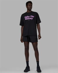 Man wearing Unisex Enjoy The Journey FLXCotton Tee Oversize - Black-Light Violet | Thumbnail Index: 11