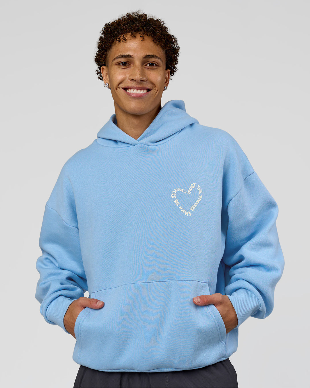 Man wearing Unisex Love The Process Oversize Hoodie - Open Air-Off White | Model:Leandro | Size:M - view 14