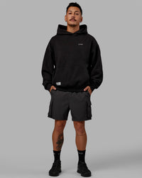 Man wearing Unisex VS6 Hoodie Oversize - Black-White | Thumbnail Index: 4
