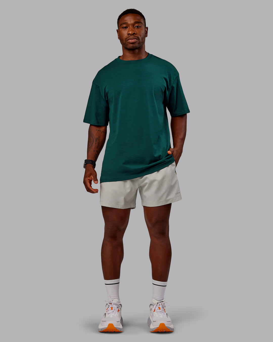 Man wearing Variation FLXCotton Oversized Tee in Dark Moss-Digital Mist | Size:M - view 11